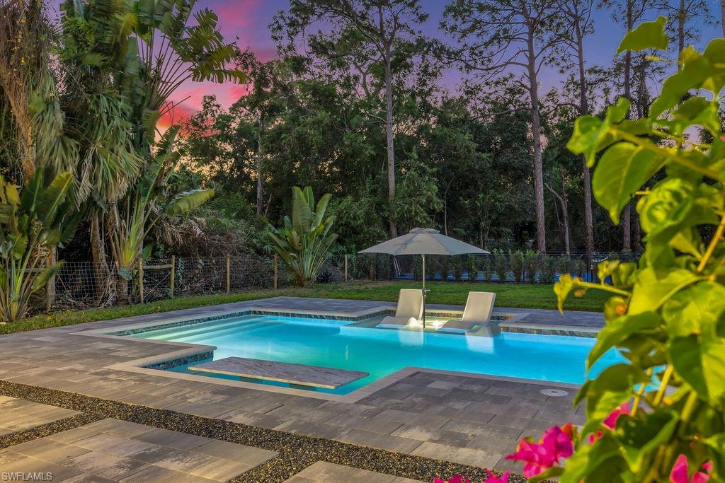 3155 64th Street Southwest Naples, FL 34105 - Photo 42 of 45 a view of a backyard with swimming pool