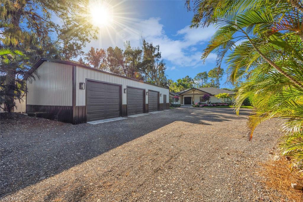 3155 64th Street Southwest Naples, FL 34105 - Photo 5 of 45 a view of a house with a yard