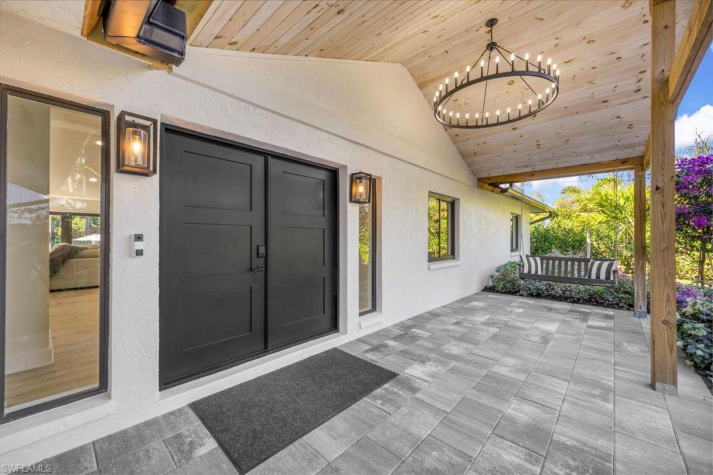 3155 64th Street Southwest Naples, FL 34105 - Photo 6 of 45 a view of a porch