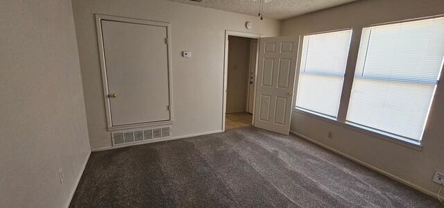 2318 33rd Street Lubbock, TX 79411 - Photo 2 of 8 an empty room with windows