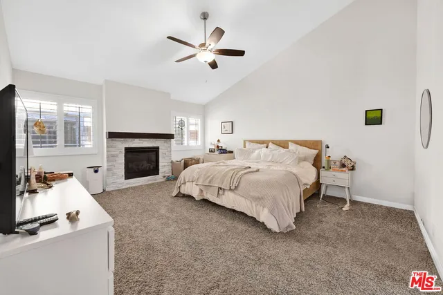 a bed room with a bed and a fireplace