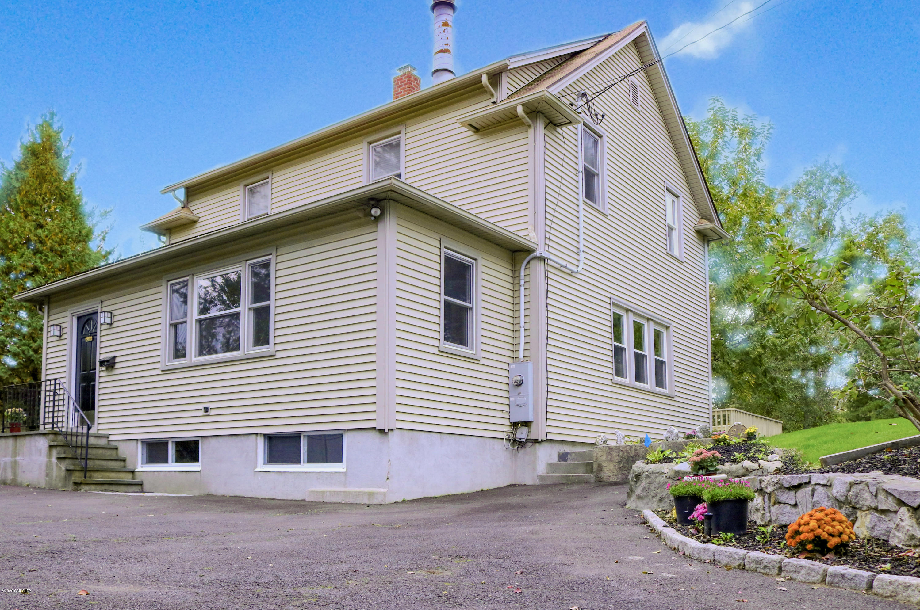 57 Shore Road Old Greenwich, CT 06870 - Photo 1 of 30 a front view of a house with a yard