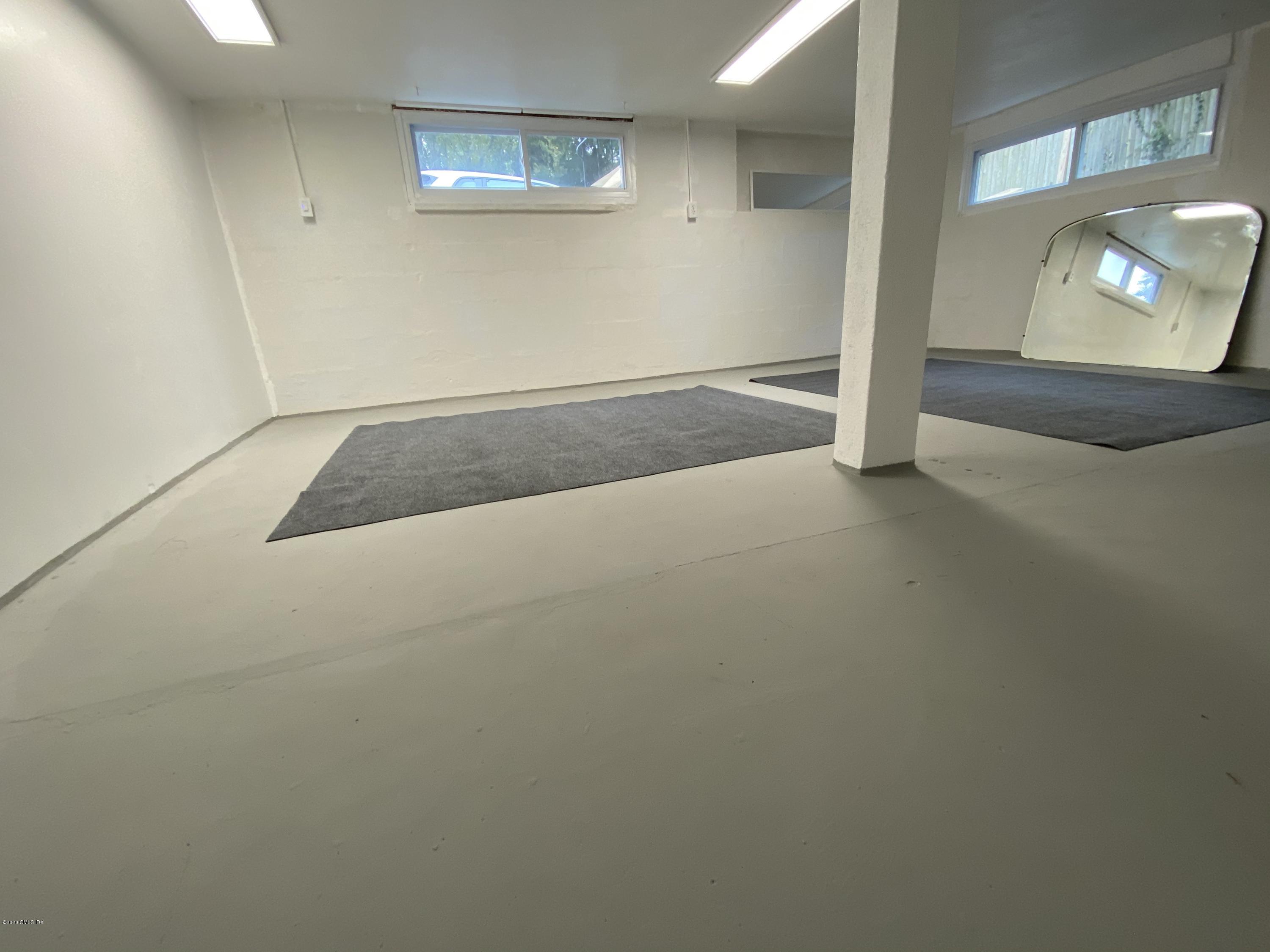 57 Shore Road Old Greenwich, CT 06870 - Photo 27 of 30 an empty room with a mirror