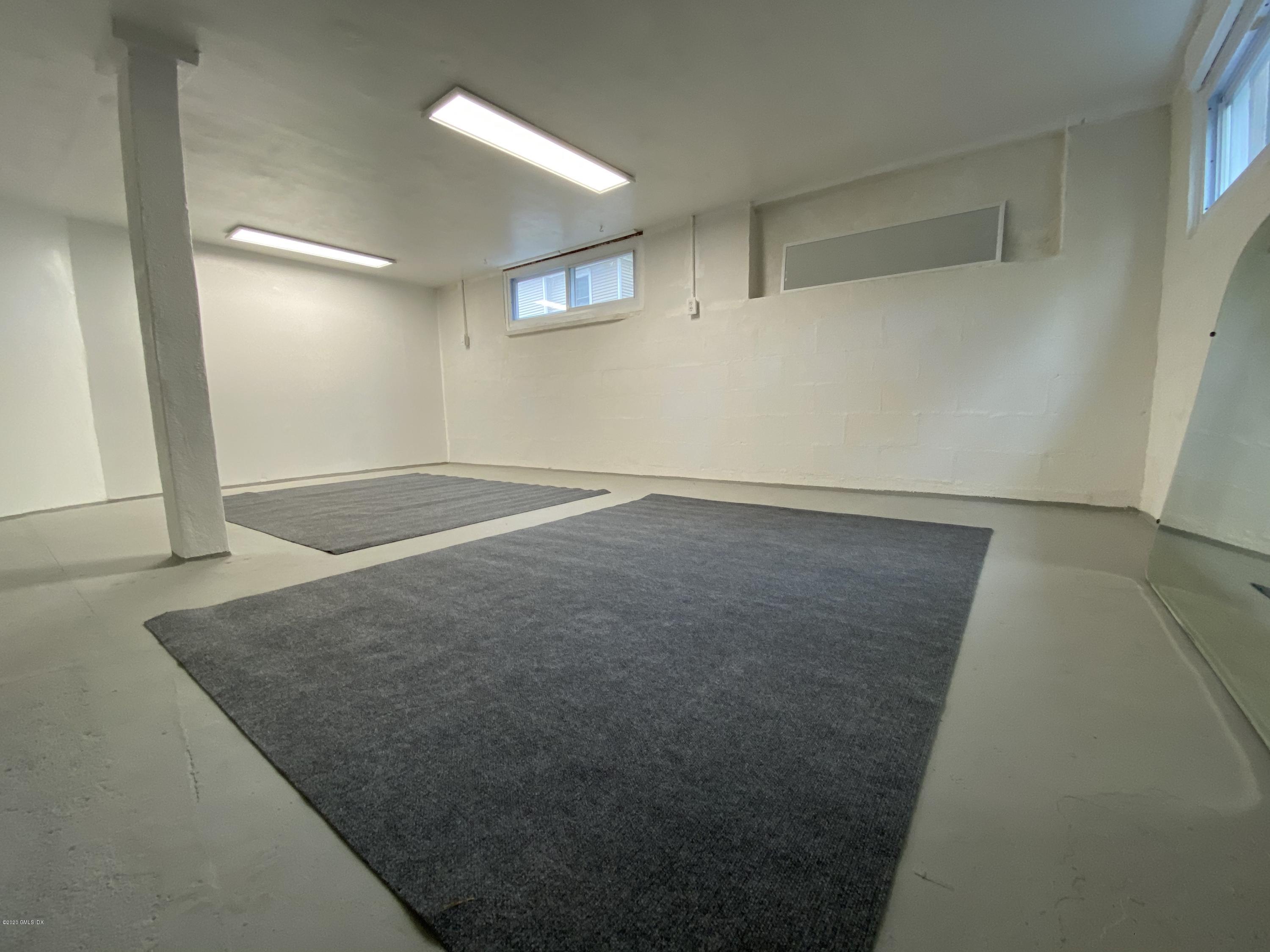 57 Shore Road Old Greenwich, CT 06870 - Photo 28 of 30 an empty room with wooden floor