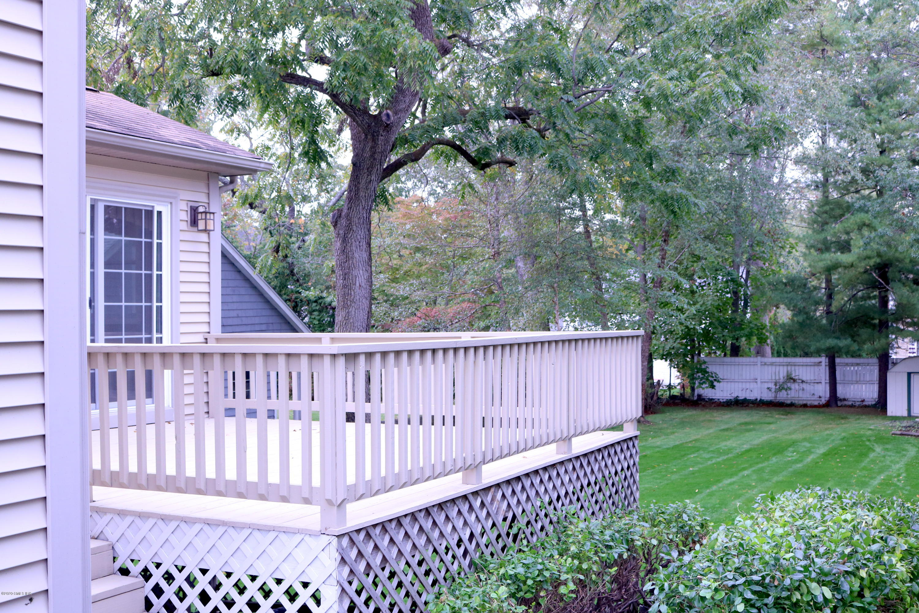 57 Shore Road Old Greenwich, CT 06870 - Photo 5 of 30 a view of a backyard with a swing