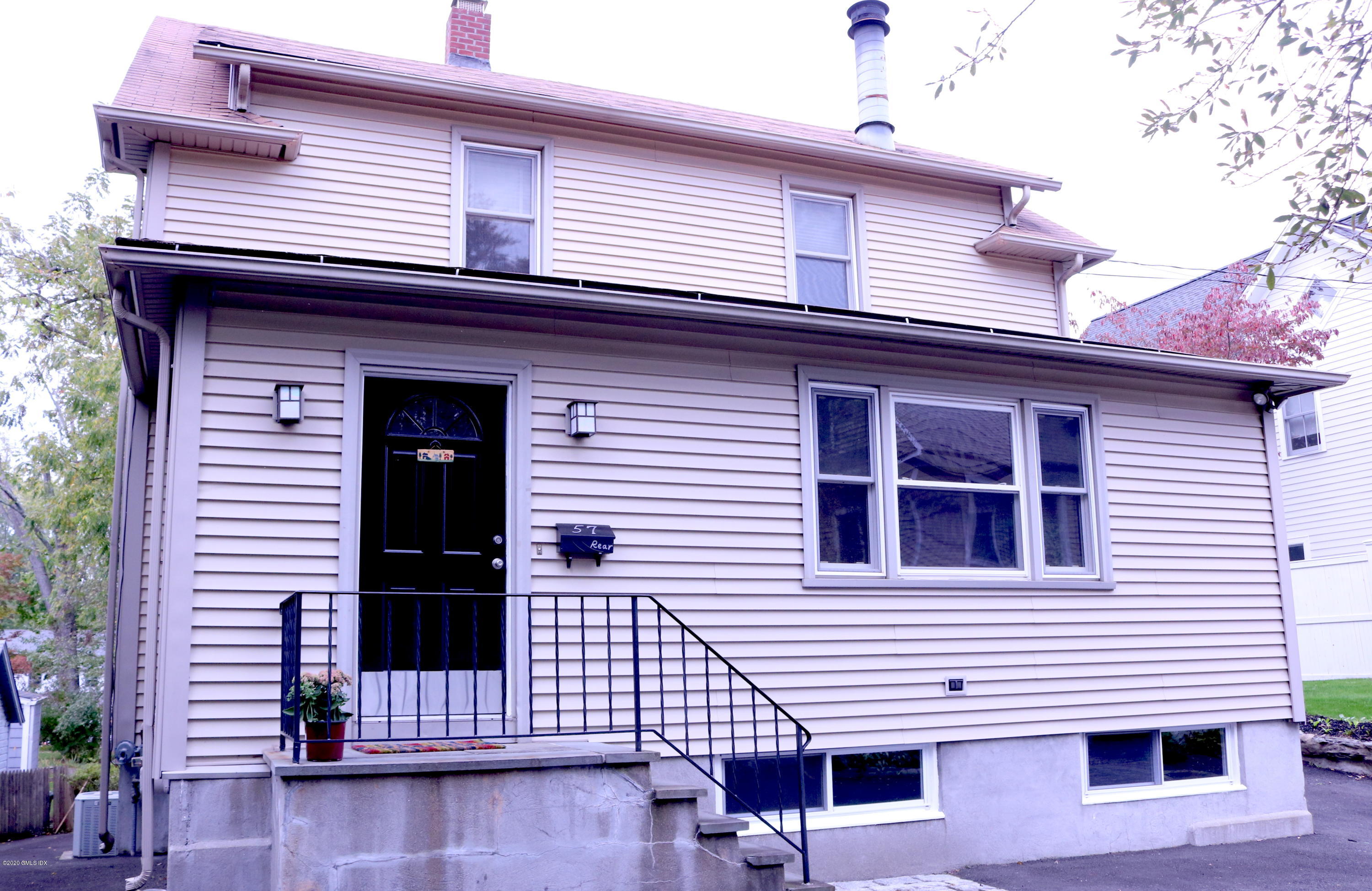 57 Shore Road Old Greenwich, CT 06870 - Photo 6 of 30 a front view of a house with stairs