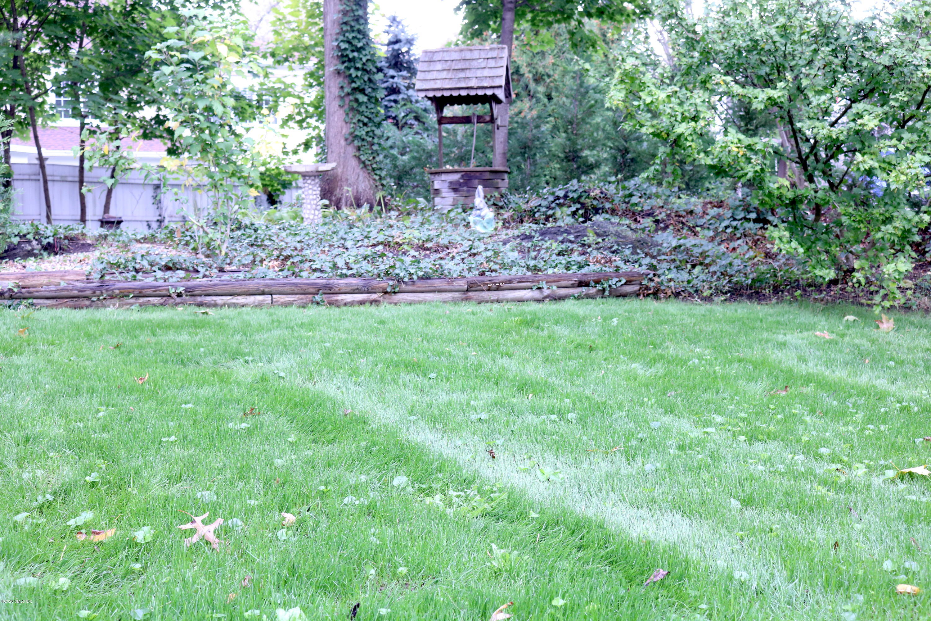 57 Shore Road Old Greenwich, CT 06870 - Photo 8 of 30 a backyard of a house with lots of green space