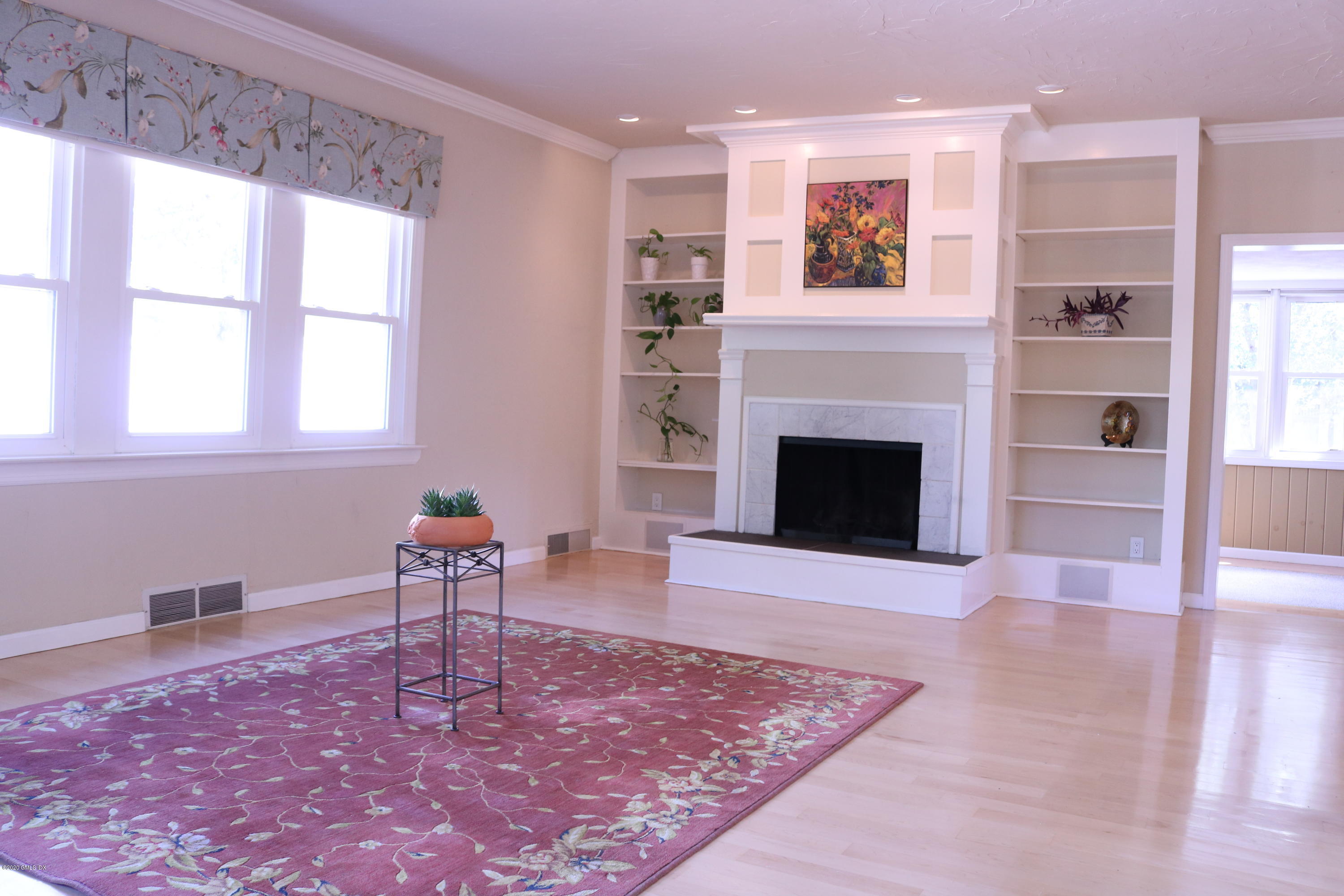 57 Shore Road Old Greenwich, CT 06870 - Photo 9 of 30 a living room with furniture and a fireplace