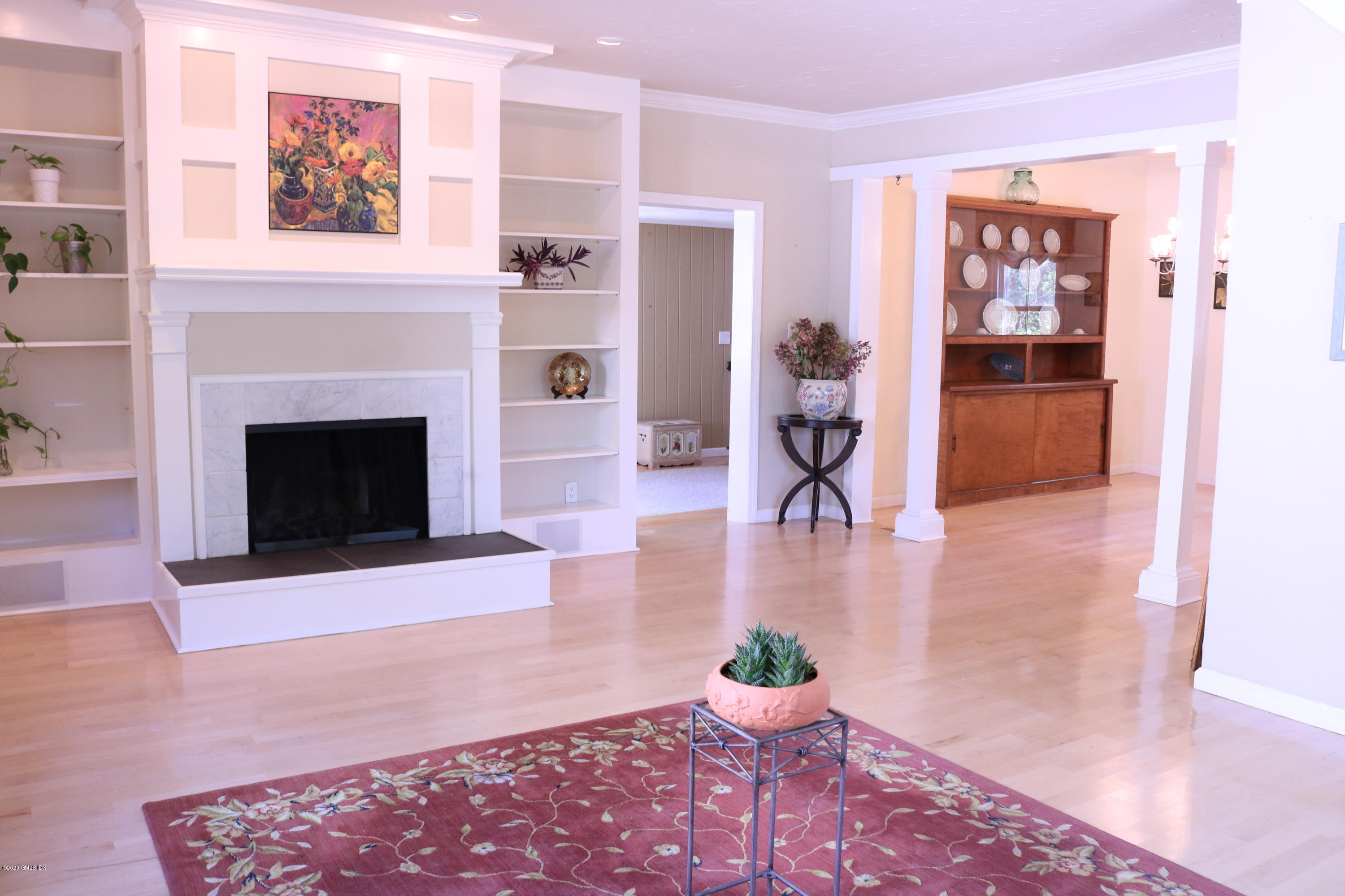 57 Shore Road Old Greenwich, CT 06870 - Photo 10 of 30 a living room with furniture and a fireplace