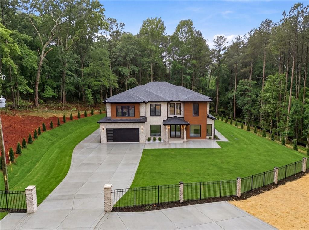 1563 Whitley Road Dacula, GA 30019 - Photo 41 of 44 a view of house with garden and outdoor seating