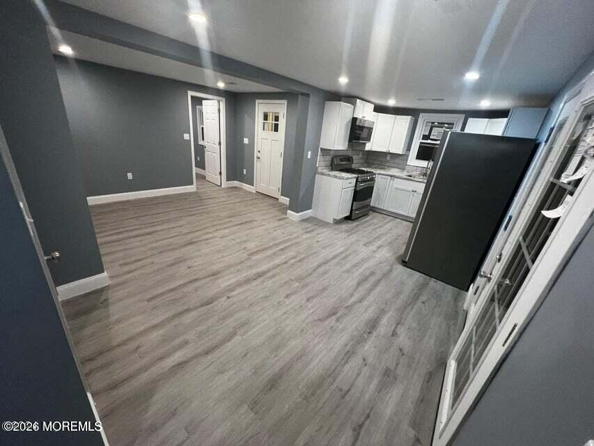 6611 Magnolia Drive Millville, NJ 08332 - Photo 8 of 14 wooden floor in an empty room with wooden floor
