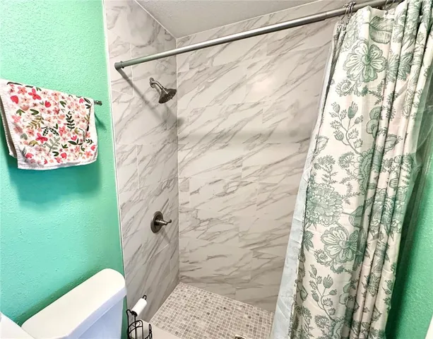 a backyard of a house with yard and outdoor seating