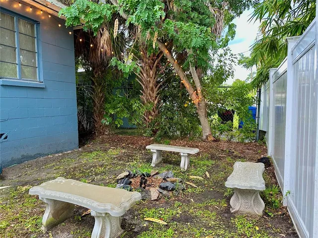 a view of swimming pool with a bench and a couch