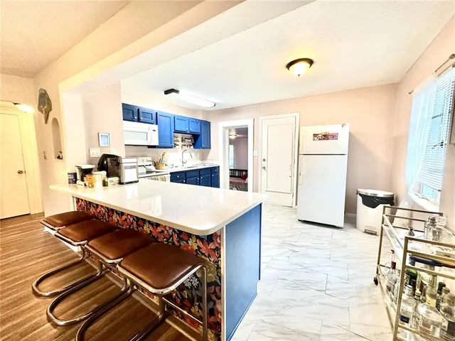a front view of a house with wooden floor