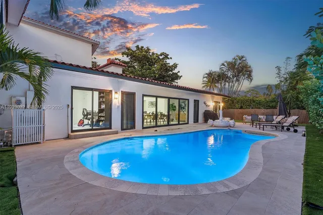 a view of a house with a yard and garage