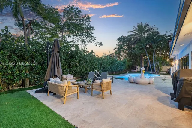 a view of a dining room with furniture window and outside view