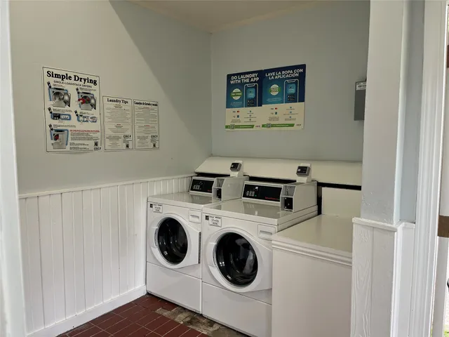 a view of swimming pool with chairs and a yard