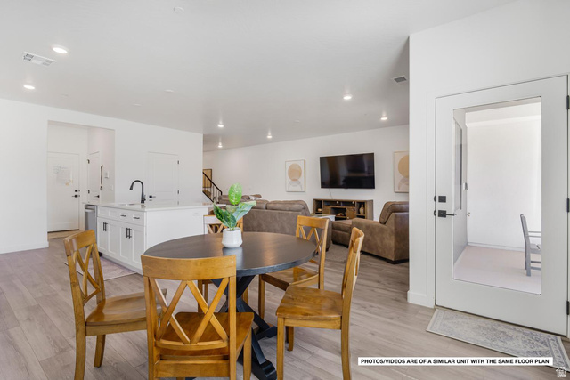1702 Ripple Rock Drive, Unit 3171 Washington, UT 84780 - Photo 7 of 16 Open-concept living area featuring light wood-finish flooring, recessed lighting, and white walls
