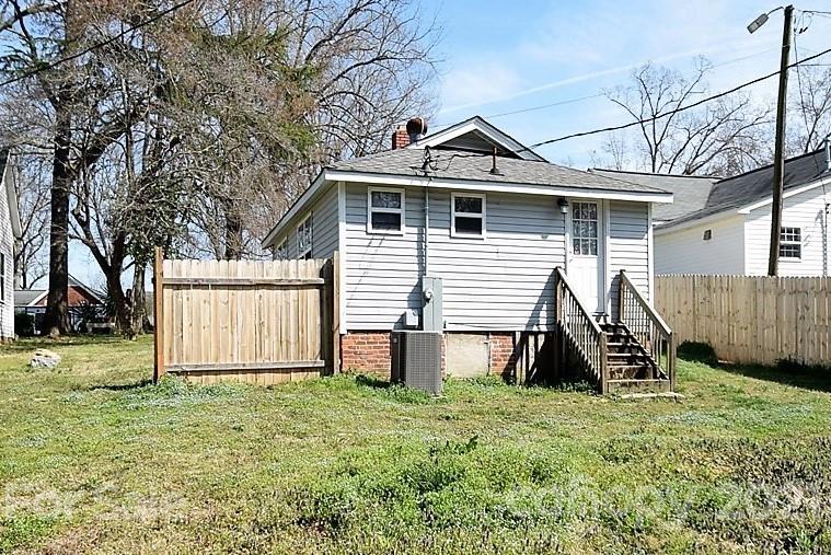 4707 Boyd Griffin Road Monroe, NC 28110 - Photo 12 of 12 a view of a house with a yard and wooden fence