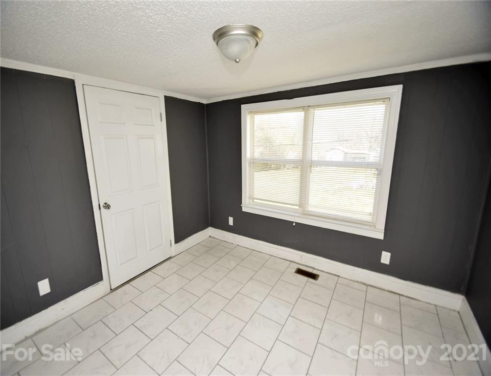 4707 Boyd Griffin Road Monroe, NC 28110 - Photo 8 of 12 a view of an empty room with a window