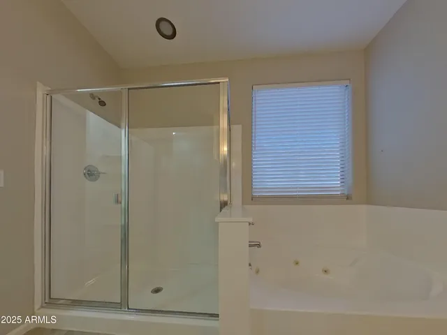 a bathroom with a double vanity sink and mirror