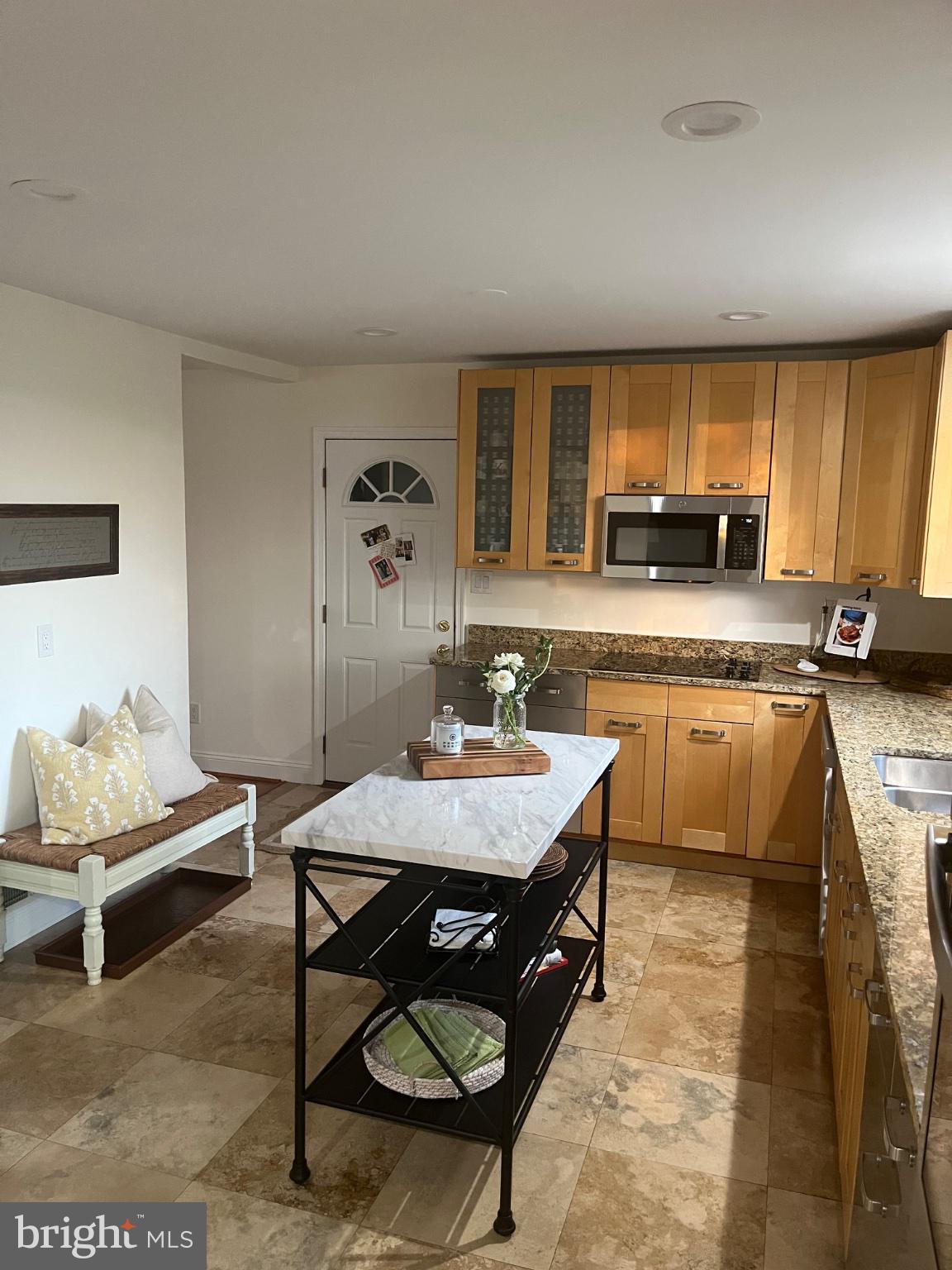 304 Old Courthouse Road Northeast Vienna, VA 22180 - Photo 6 of 25 Modern kitchen with warm wood tones.