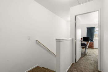 1666 Palma Road Bullhead City, AZ 86442 - Photo 11 of 22 a view of a hallway with a white walls and a bathroom