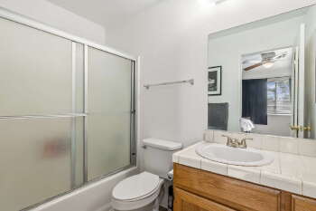 1666 Palma Road Bullhead City, AZ 86442 - Photo 17 of 22 a bathroom with a granite countertop sink toilet and shower