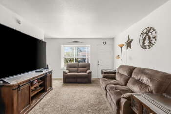 1666 Palma Road Bullhead City, AZ 86442 - Photo 3 of 22 a living room with furniture and a flat screen tv