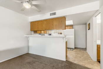 1666 Palma Road Bullhead City, AZ 86442 - Photo 6 of 22 a room with a sink a chandelier and a refrigerator