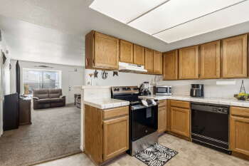 1666 Palma Road Bullhead City, AZ 86442 - Photo 7 of 22 a kitchen with a sink stove and cabinets