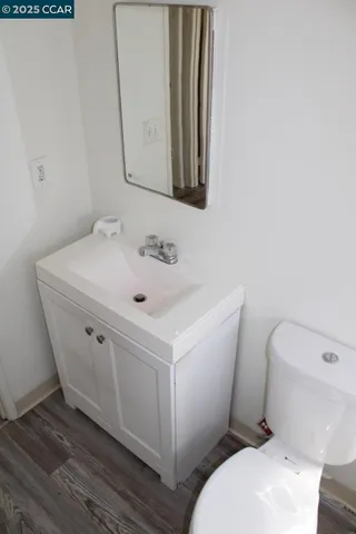 a white toilet sitting next to a bathroom sink