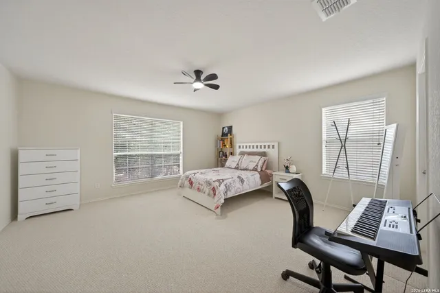 a bedroom with furniture and a window