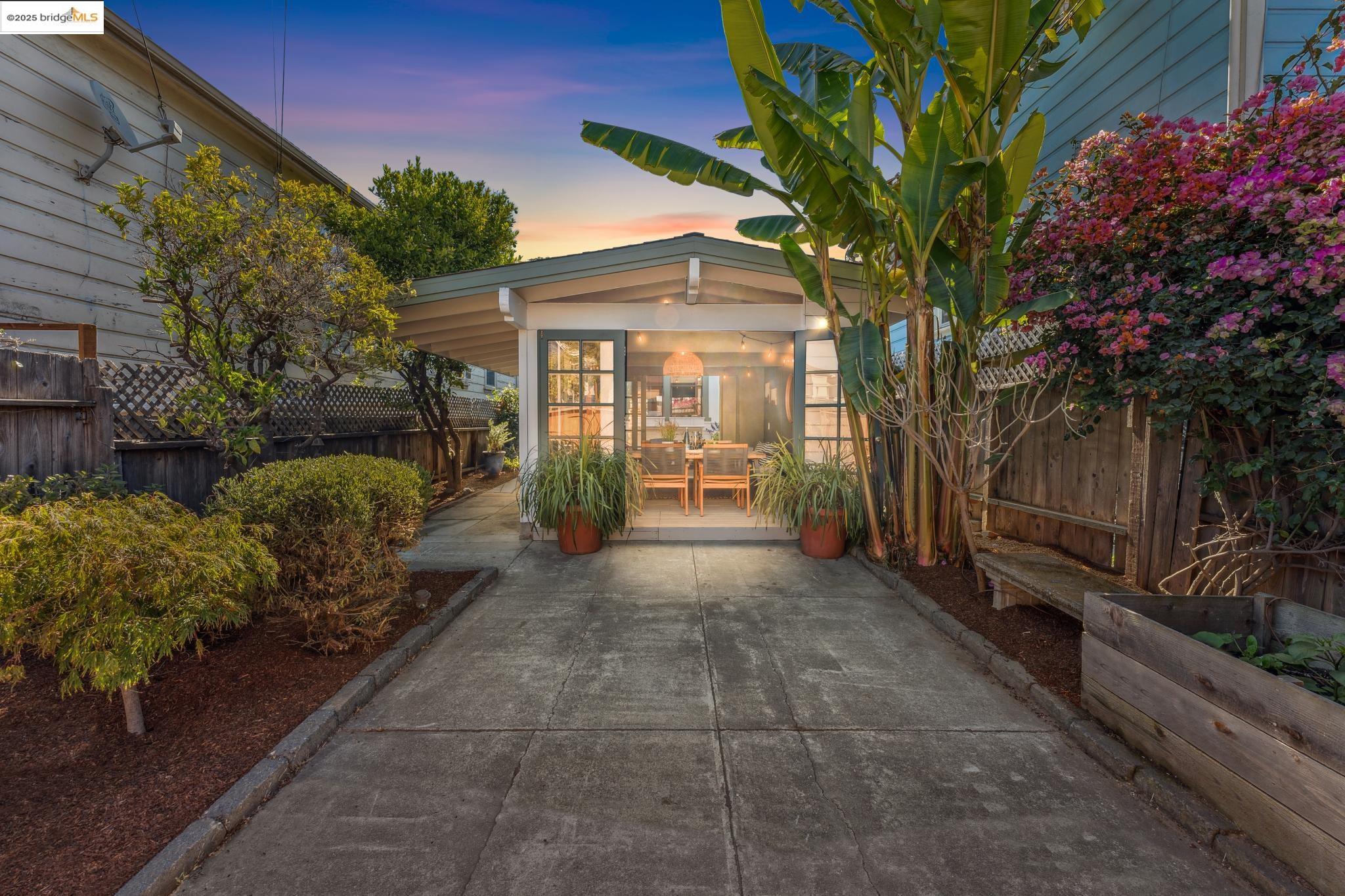 a view of a pathway with a house in the background
