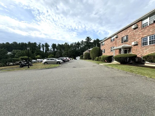 a view of a street with cars