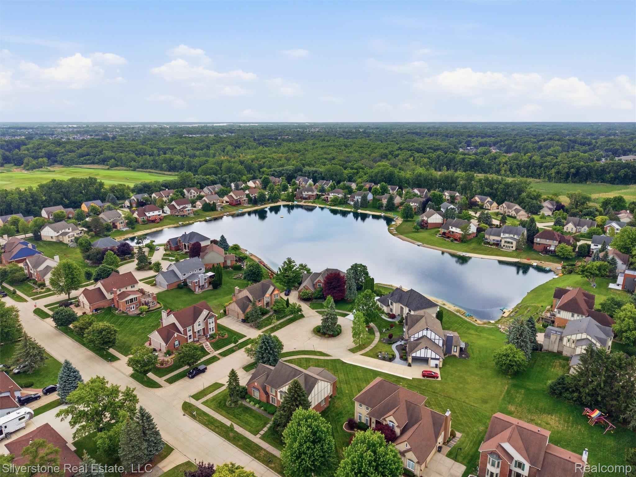 6577 Edith Court Troy, MI 48085 - Photo 57 of 61 Aerial perspective featuring a residential area with a prominent central lake