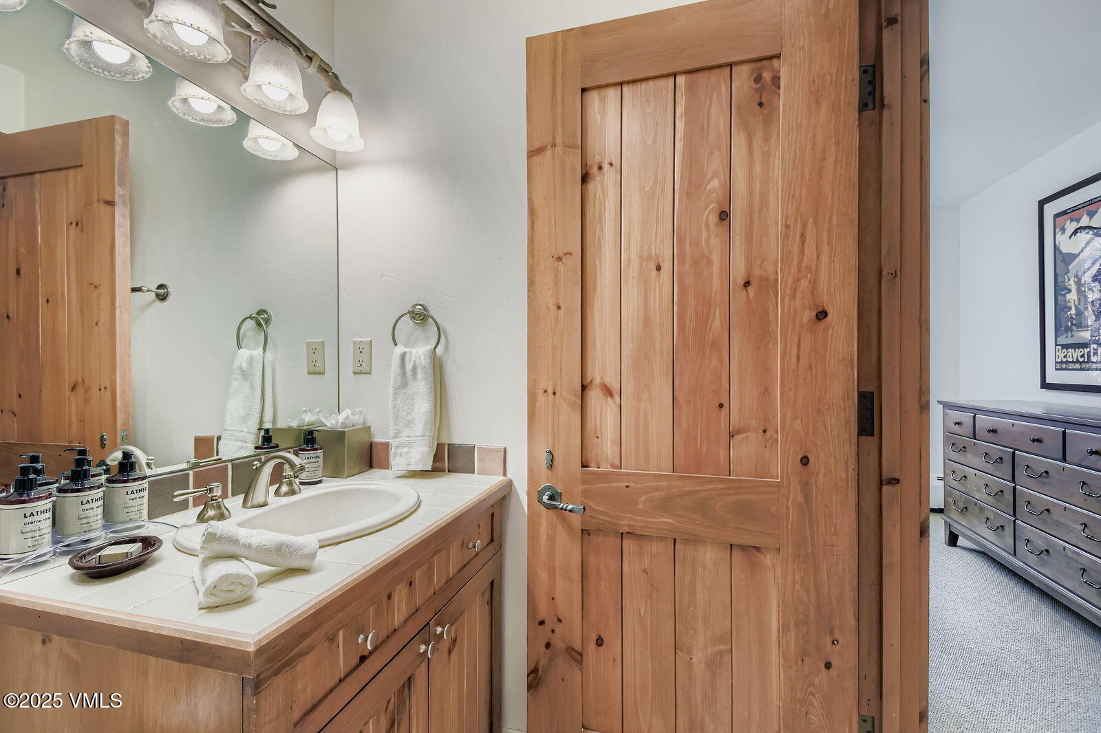 51 Offerson Road, Unit 202 Beaver Creek, CO 81620 - Photo 11 of 19 a bathroom with a sink vanity and a mirror