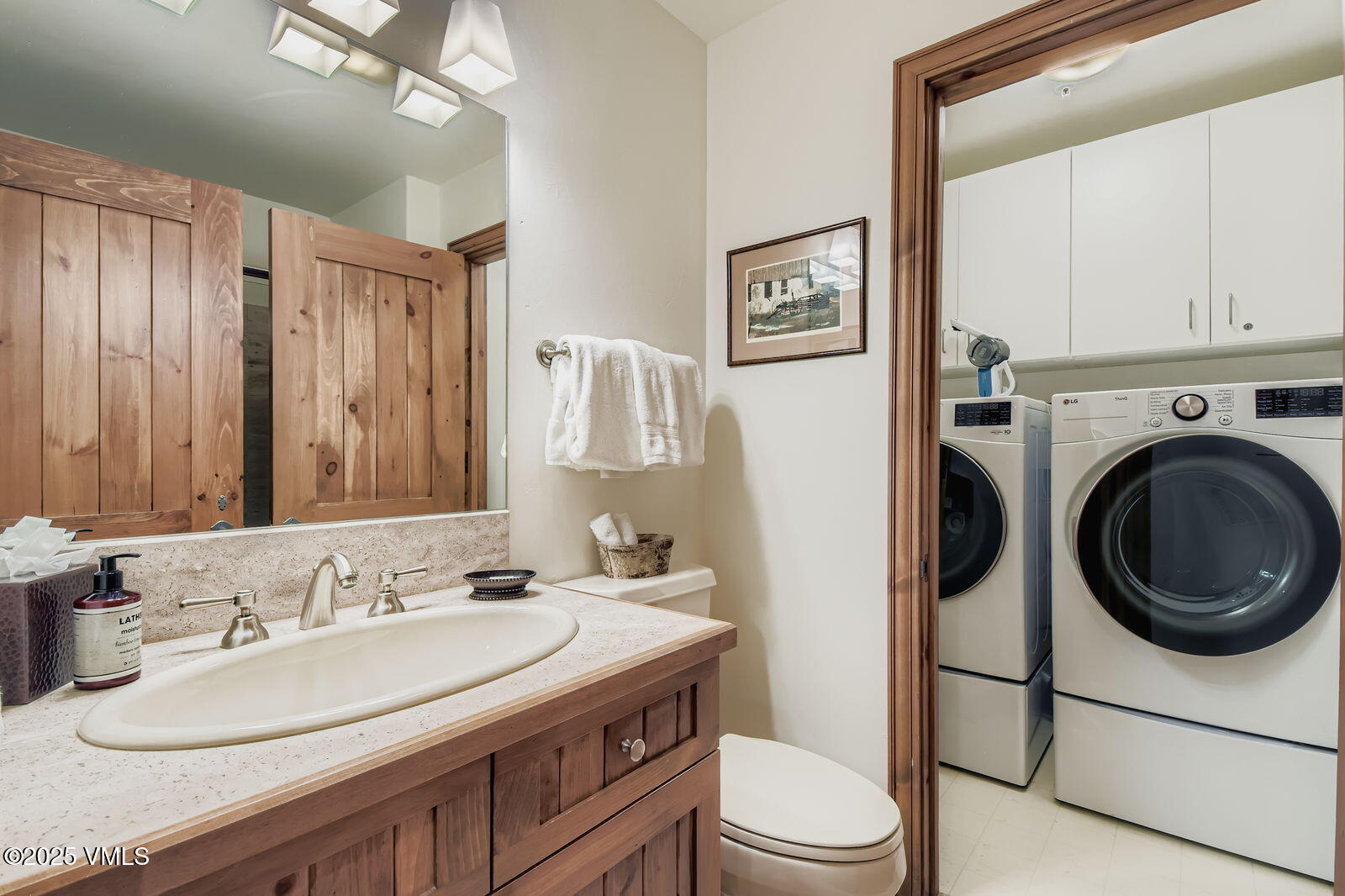 51 Offerson Road, Unit 202 Beaver Creek, CO 81620 - Photo 13 of 19 a bathroom with a granite countertop sink toilet mirror and vanity