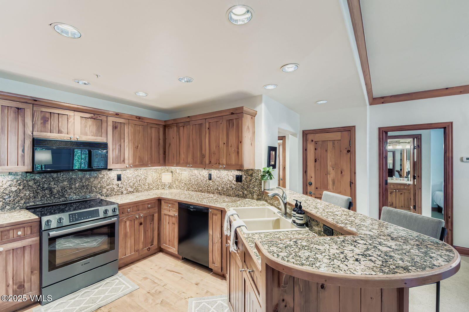 51 Offerson Road, Unit 202 Beaver Creek, CO 81620 - Photo 6 of 19 a kitchen with a sink stove and oven