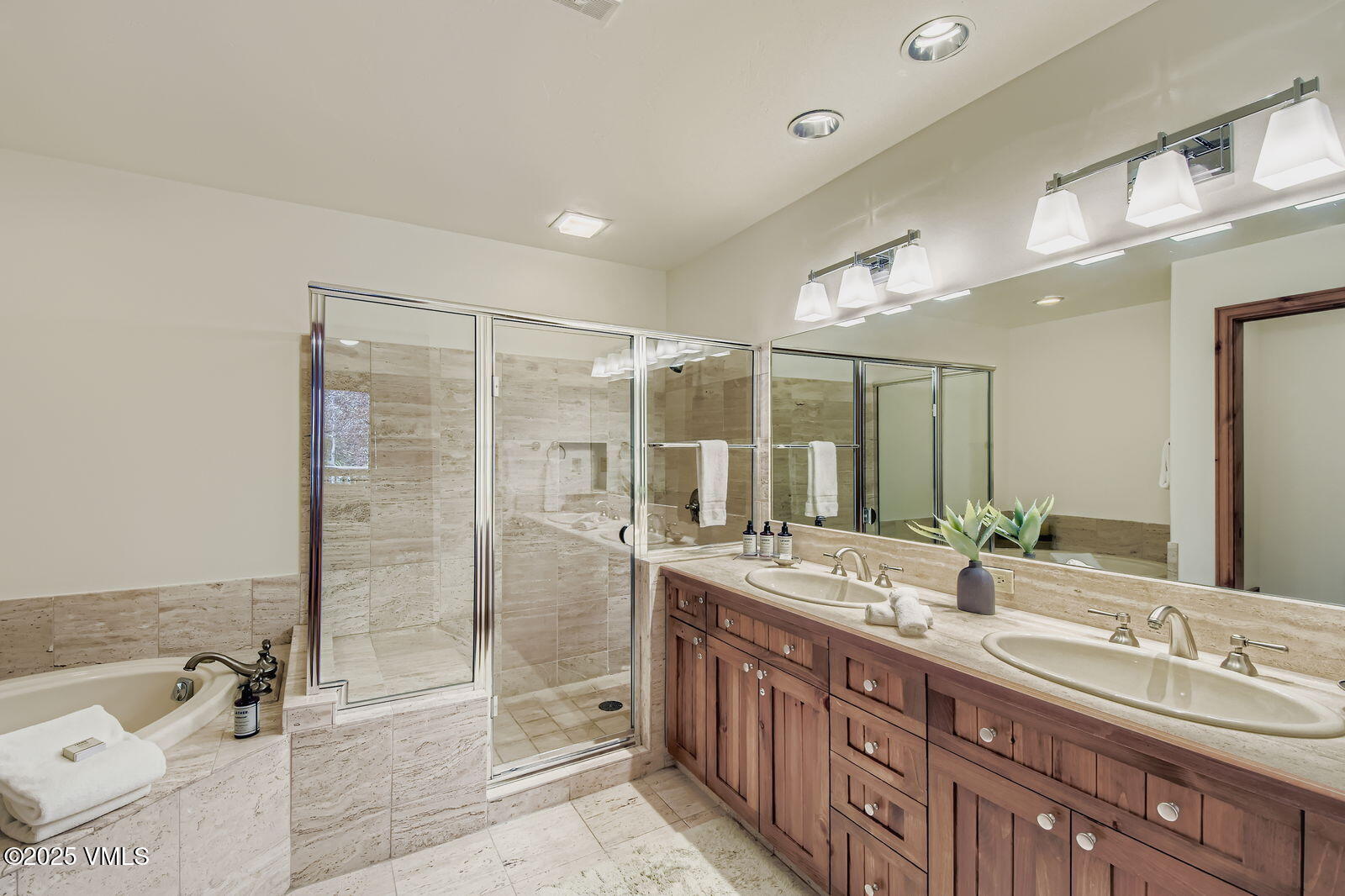 51 Offerson Road, Unit 202 Beaver Creek, CO 81620 - Photo 9 of 19 a bathroom with a double vanity sink toilet mirror and bathtub