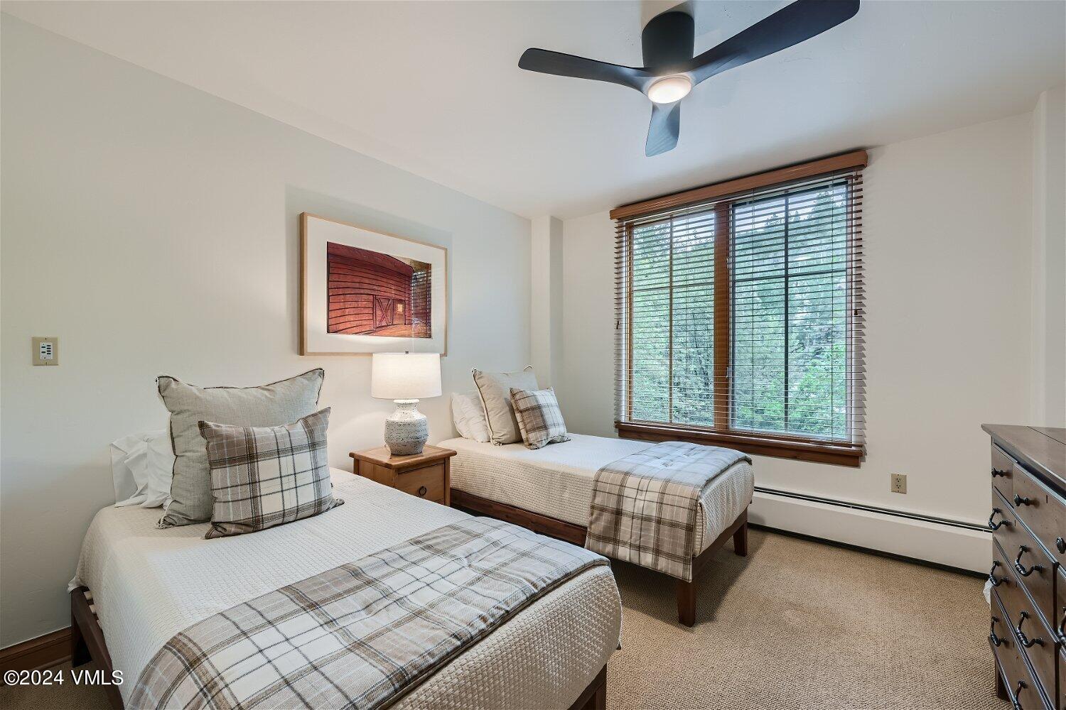 51 Offerson Road, Unit 202 Beaver Creek, CO 81620 - Photo 10 of 19 a bedroom with two beds and a window