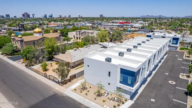 an aerial view of a house with outdoor space