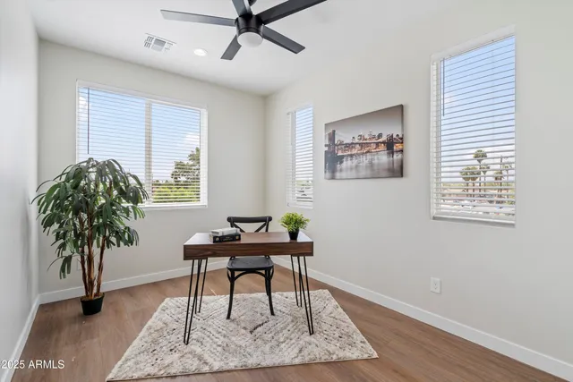 a workspace with furniture and a potted plant