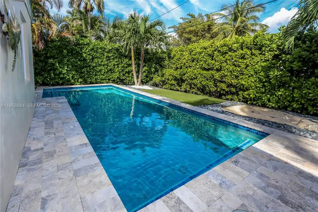 a view of swimming pool with a yard