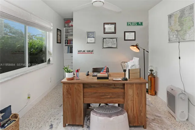 a work room with furniture and wooden floor
