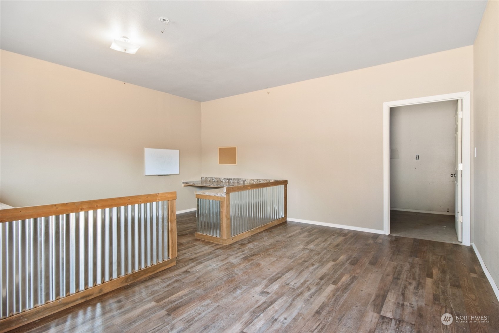 4840 176th Avenue Southwest Rochester, WA 98579 - Photo 19 of 38 a view of hallway with stairs and wooden floor