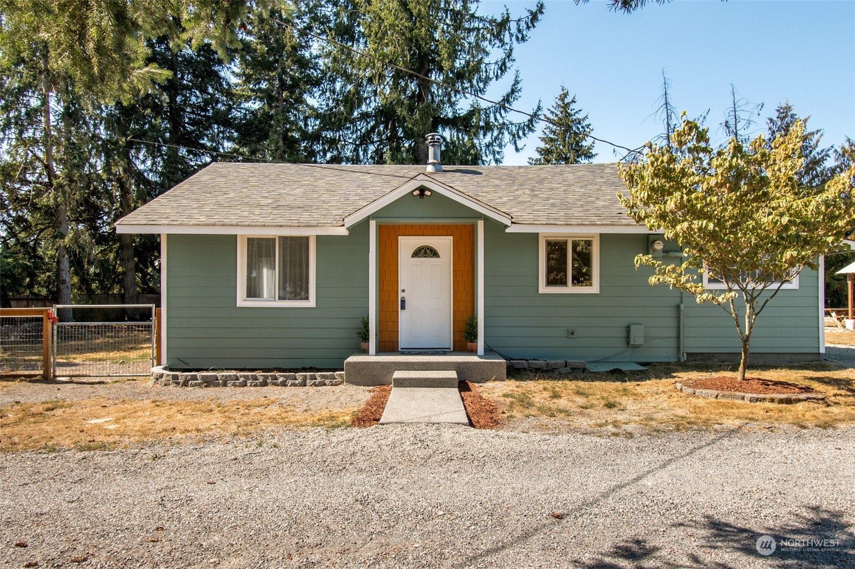 4840 176th Avenue Southwest Rochester, WA 98579 - Photo 2 of 38 a front view of a house with a tree