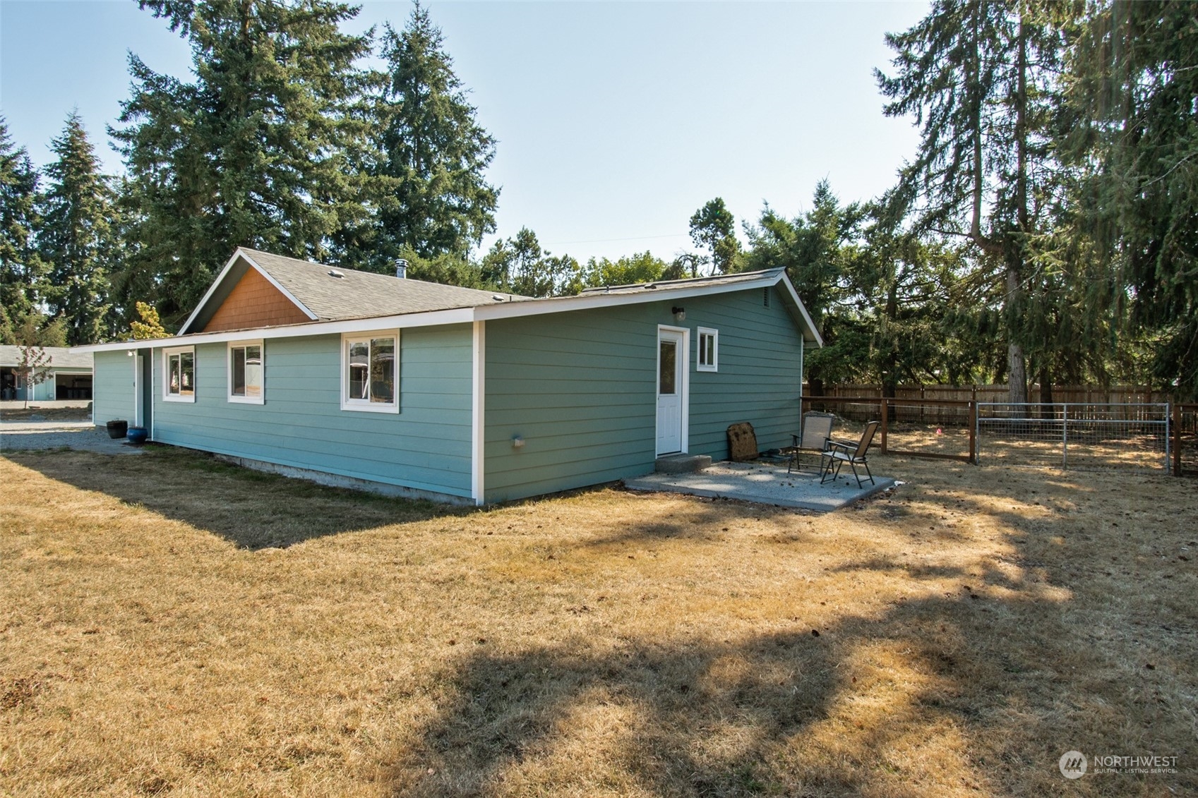 4840 176th Avenue Southwest Rochester, WA 98579 - Photo 28 of 38 a view of a house with backyard and trees