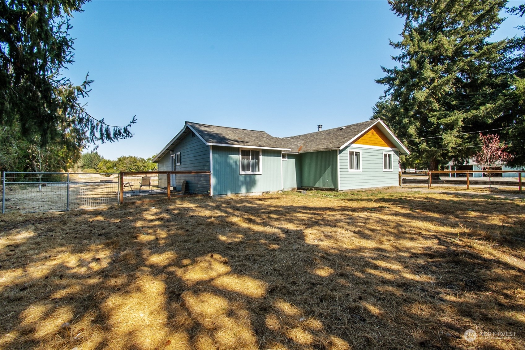 4840 176th Avenue Southwest Rochester, WA 98579 - Photo 30 of 38 a view of house with backyard and tree