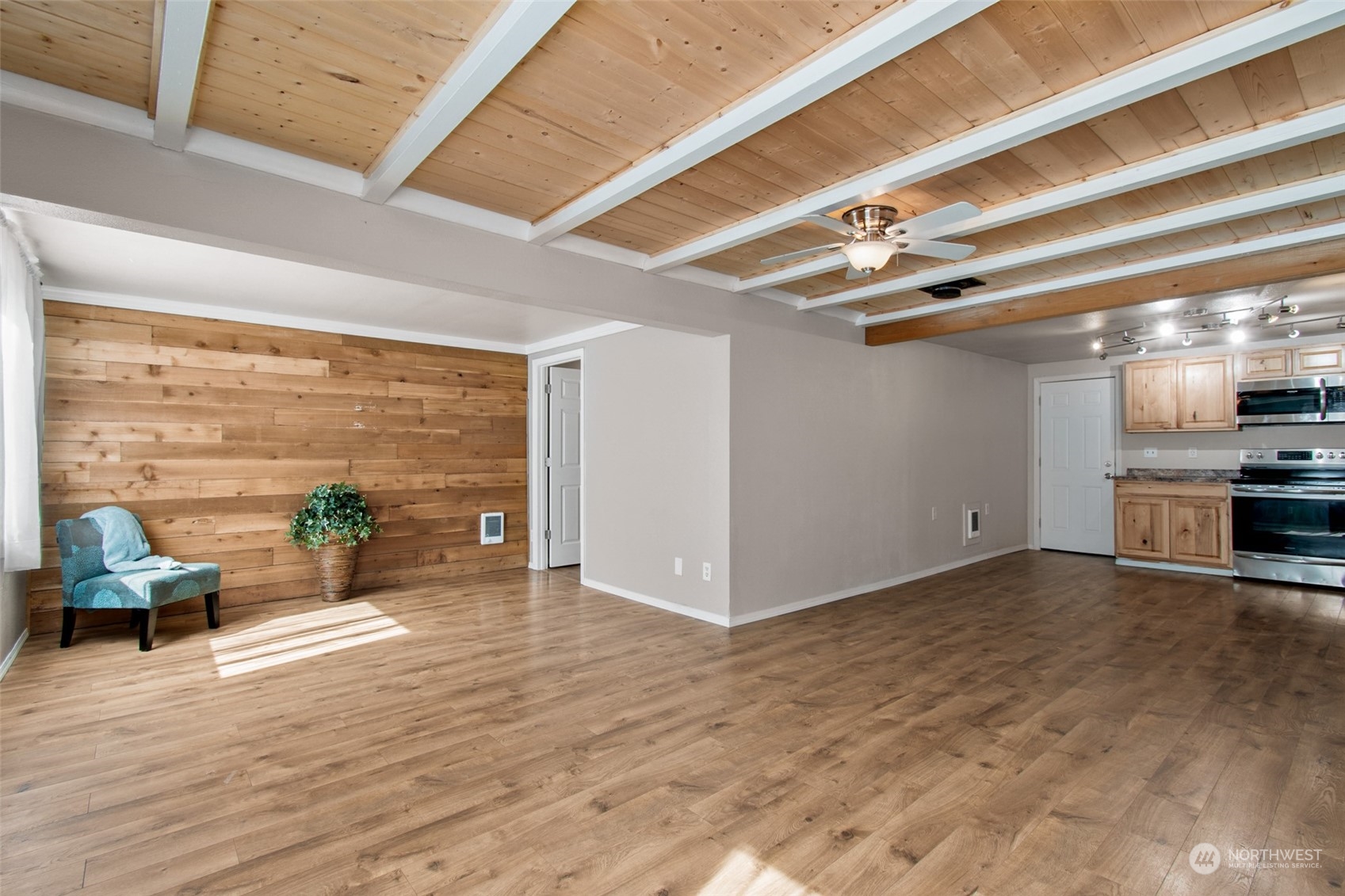 4840 176th Avenue Southwest Rochester, WA 98579 - Photo 6 of 38 a view of a living room a stove and wooden floor